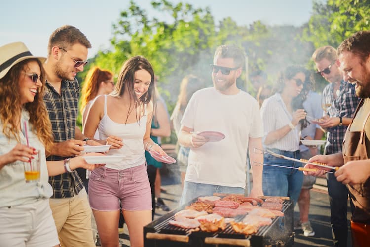 friends have a cookout with fresh food in a Dallas park on Memorial Day Weekend