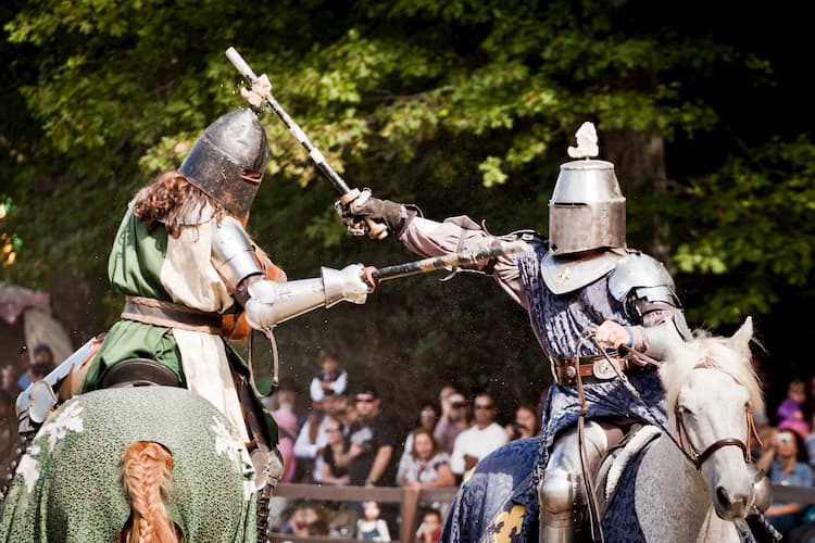 knights have a sword fight on horses at the scarborough renaissance festival