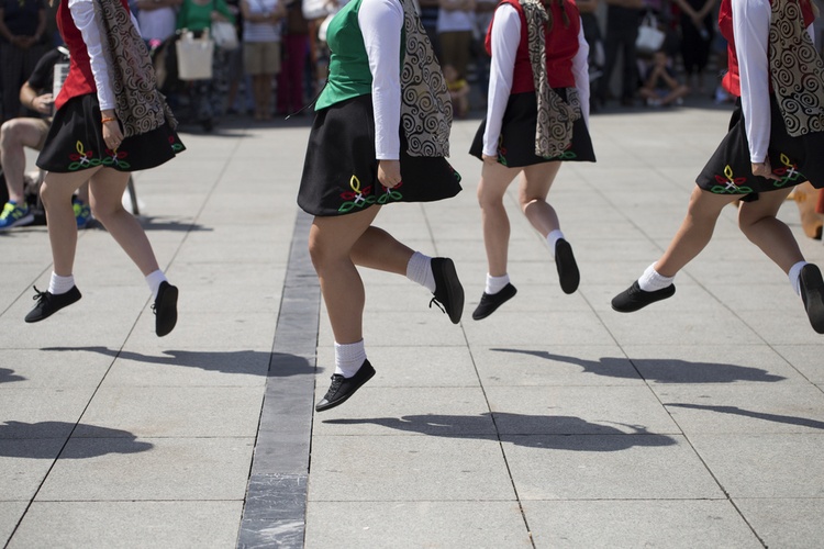 people doing traditional irish dances in a festival