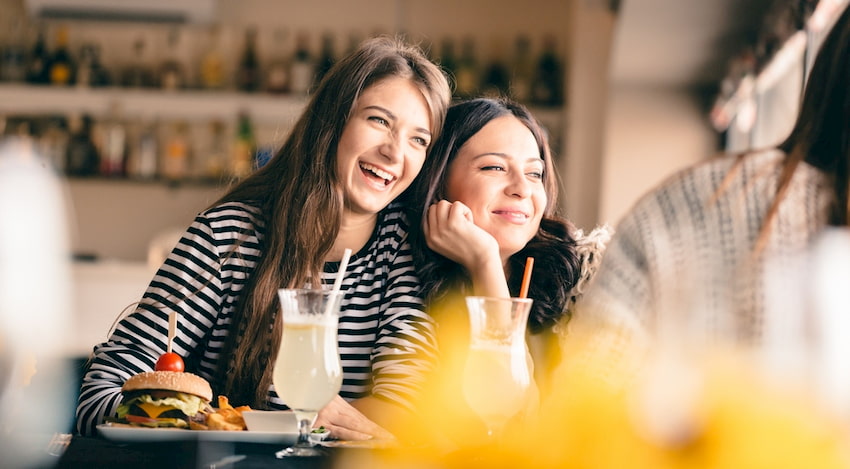 A mother and daughter eating brunch.