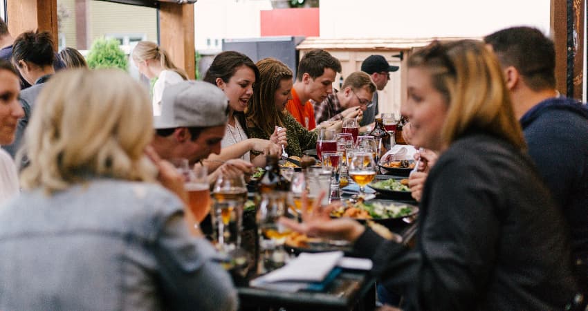 a large group of people dining at a table