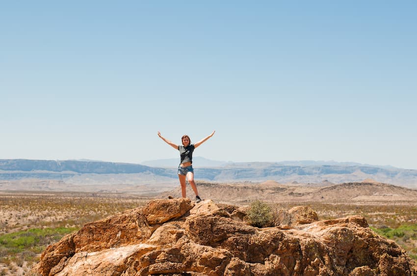 Woman standing on hill top at Big Bend National Park