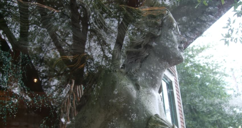 A stone statue in the window of a storefront in Old Town Spring, Texas