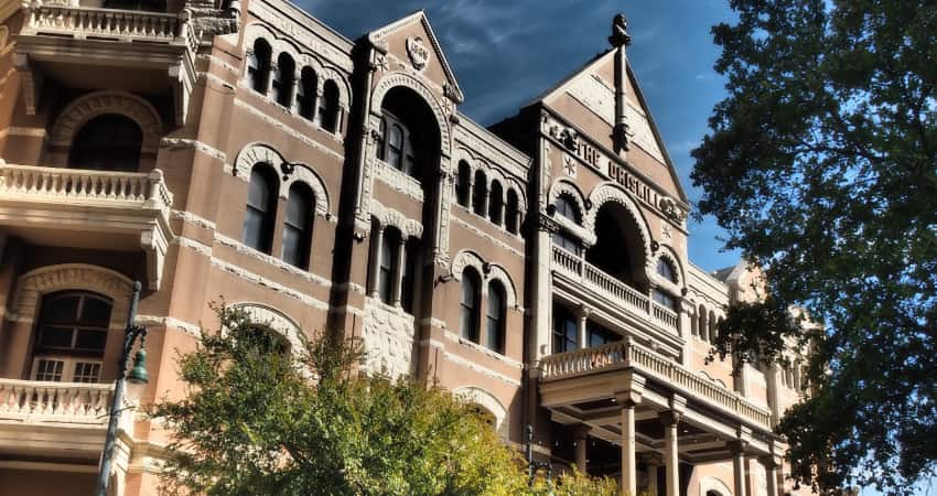 The exterior of the Driskill Hotel at sunset