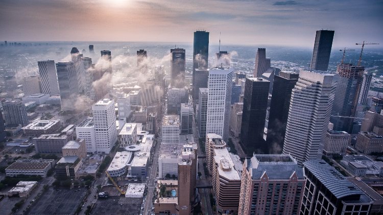 a view of the houston skyline at dusk