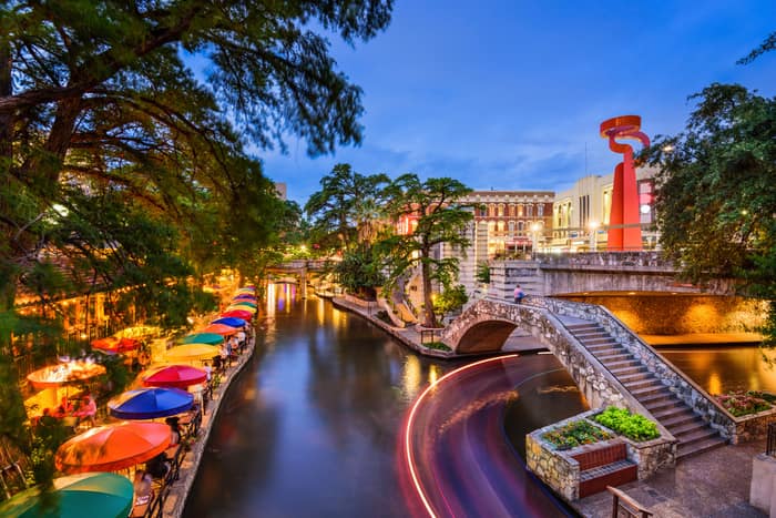 a view of the san antonio riverwalk at dusk