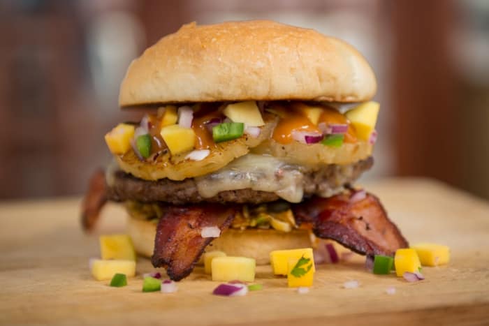  a tall burger with bacon and corn salsa