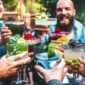 a group of friends toasting margaritas