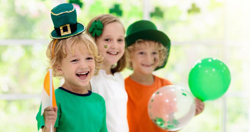 group of children dressed up for st patricks day and smiling