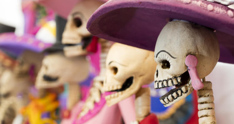 A group of skeletons with hats on them